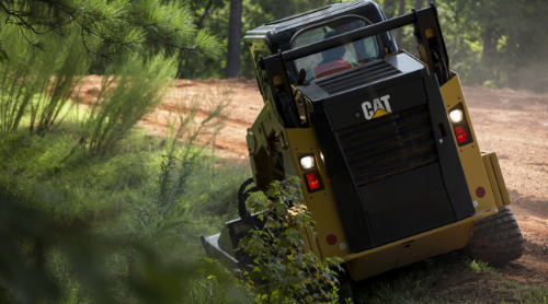 CAT equipment mowing grass