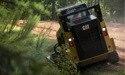 CAT equipment mowing grass