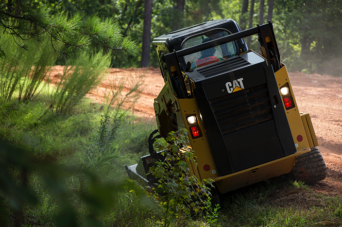 CAT equipment mowing grass