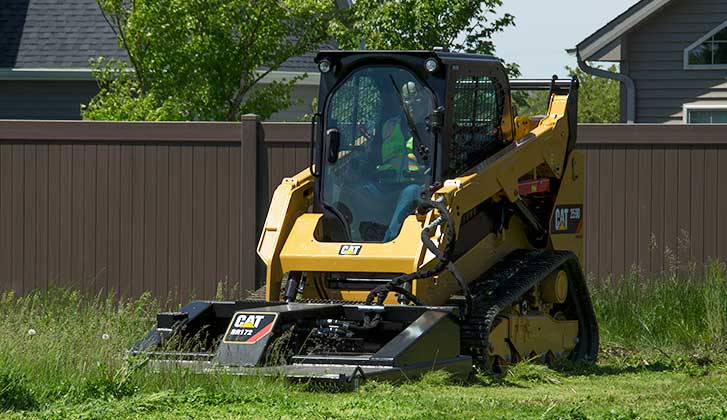 CAT equipment mowing grass