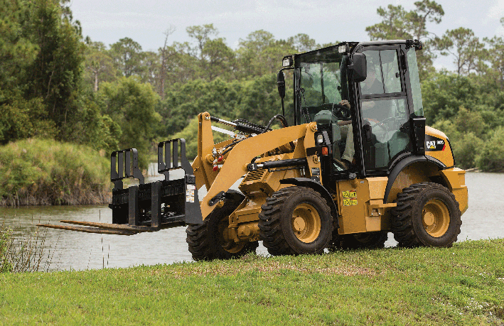 CAT compact equipment near pond