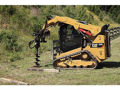 Compact track loader rental digging into grass