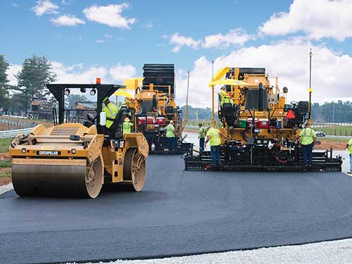 CAT equipment paving a road